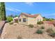 View of home's back elevation and backyard at 9101 Dolphin Cove Ct, Las Vegas, NV 89117