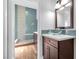 Modern bathroom with glass sink and pebble tile accents at 9101 Dolphin Cove Ct, Las Vegas, NV 89117