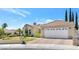 Single story house with a large backyard and a two-car garage at 9101 Dolphin Cove Ct, Las Vegas, NV 89117