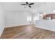 Bright living room with wood floors, fireplace, and high ceilings at 9101 Dolphin Cove Ct, Las Vegas, NV 89117