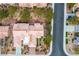 Aerial view of a residential neighborhood showcasing single Gathering homes, mature trees, and nearby streets at 9300 Villa Ridge Dr, Las Vegas, NV 89134