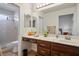 Bathroom featuring a vanity, sink, drawers and cabinets with shower visible in the mirror at 9300 Villa Ridge Dr, Las Vegas, NV 89134