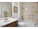 Bathroom featuring a cultured marble sink, vanity, toilet, and tub/shower combination at 9300 Villa Ridge Dr, Las Vegas, NV 89134