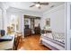 Bedroom featuring hardwood floors, built in shelving and storage at 9300 Villa Ridge Dr, Las Vegas, NV 89134