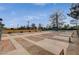 Outdoor shuffleboard courts with mature landscaping and clear blue sky provides an active recreational space at 9300 Villa Ridge Dr, Las Vegas, NV 89134