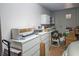 A spacious storage room with multiple white shelving units and dressers filled with various stored items at 9300 Villa Ridge Dr, Las Vegas, NV 89134