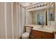 Bathroom featuring a shower-tub combo with a shower curtain, and vanity with a sink at 9995 Yellow Canary Ave, Las Vegas, NV 89117