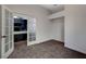 A comfortable bedroom with a closet and gray carpet, complemented by a double-door entry at 9995 Yellow Canary Ave, Las Vegas, NV 89117