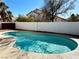 Backyard pool with privacy fence, perfect for relaxing and entertaining in the sun at 9995 Yellow Canary Ave, Las Vegas, NV 89117