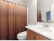 Well-lit bathroom featuring a shower with curtain, ample vanity space, and sink at , Las Vegas, NV 89122