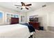 Relaxing bedroom featuring plush carpet and a TV on top of a dresser at , Las Vegas, NV 89122