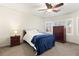 Cozy bedroom with a ceiling fan, carpeted floors, and shutters on the windows at , Las Vegas, NV 89122