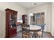 A dining area with an adjacent cabinet and a sliding glass door leading to the backyard at , Las Vegas, NV 89122