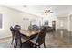 A formal dining room with tile floors, a ceiling fan, and a decorative table setting at , Las Vegas, NV 89122