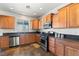 Spacious kitchen featuring stainless steel appliances, granite countertops, and ample cabinet space at 3992 Welsh Pony St, Las Vegas, NV 89122