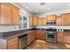 Charming kitchen featuring stainless steel appliances, granite countertops and wood cabinetry at 3992 Welsh Pony St, Las Vegas, NV 89122