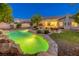 Aerial view of a house with a backyard, pool, patio, and lush landscaping at 10528 Meadow Mist Ave, Las Vegas, NV 89135