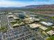 A dynamic aerial view captures the vibrant shopping center nestled against a backdrop of distant mountains at 10528 Meadow Mist Ave, Las Vegas, NV 89135