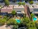 Aerial shot featuring a private backyard oasis with a unique pool design and mature trees at 10528 Meadow Mist Ave, Las Vegas, NV 89135