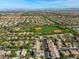 Panoramic aerial view showcasing a neighborhood with a large baseball field at 10528 Meadow Mist Ave, Las Vegas, NV 89135