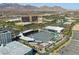 Aerial view of a baseball stadium set against a cityscape with mountains in the distance at 10528 Meadow Mist Ave, Las Vegas, NV 89135