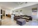 Open concept layout featuring a cozy living room connected to a modern kitchen, all enhanced by an abundance of natural light at 10528 Meadow Mist Ave, Las Vegas, NV 89135