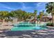 Community pool with water slides, ample seating, and well-maintained landscaping at 10528 Meadow Mist Ave, Las Vegas, NV 89135