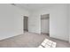 Bedroom features neutral carpet, a closet, and white walls at 107 Topsail Dr, Boulder City, NV 89005