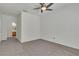 Spacious bedroom with neutral carpet and a ceiling fan at 107 Topsail Dr, Boulder City, NV 89005