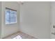 This bedroom features tile flooring, a window, and neutral walls at 107 Topsail Dr, Boulder City, NV 89005