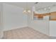 Bright dining area with neutral walls, tile flooring, pendant lighting, and open access to the kitchen at 107 Topsail Dr, Boulder City, NV 89005