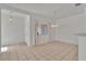 Bright dining area with neutral walls, tile flooring, and modern pendant lighting at 107 Topsail Dr, Boulder City, NV 89005