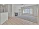 Cozy living room with a fireplace and large windows providing plenty of natural light at 107 Topsail Dr, Boulder City, NV 89005