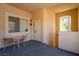 This patio features neutral walls, two windows, and a table with two chairs at 107 Topsail Dr, Boulder City, NV 89005