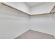 Neutral Walk-In Closet featuring carpeted floors and white walls, ready for your personalization and organization at 107 Topsail Dr, Boulder City, NV 89005