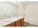 Bathroom featuring double sinks, and a shower and tub combination at 10765 Muscari Way, Las Vegas, NV 89141