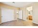 Bedroom featuring tile floors, closet with sliding doors, and an attached bathroom at 10765 Muscari Way, Las Vegas, NV 89141