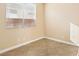 Neutral bedroom featuring tile floors and a window with blinds at 10765 Muscari Way, Las Vegas, NV 89141