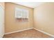 Bedroom featuring tile floors, neutral walls, and a closet with sliding doors at 10765 Muscari Way, Las Vegas, NV 89141