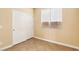 Bedroom featuring tile floors, a window with blinds and a closet with sliding doors at 10765 Muscari Way, Las Vegas, NV 89141