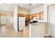 Functional kitchen with ample cabinet space, flowing into the living area at 10765 Muscari Way, Las Vegas, NV 89141