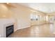 Spacious living room showcases a cozy fireplace, large windows, and ample room for entertaining at 10765 Muscari Way, Las Vegas, NV 89141