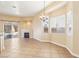 Bright living room with tile floors, a fireplace, and sliding glass door access to the backyard at 10765 Muscari Way, Las Vegas, NV 89141