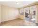 Inviting living area with tile floors and sliding glass doors leading to the backyard at 10765 Muscari Way, Las Vegas, NV 89141