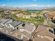 Aerial view of a home with surrounding landscape, including a golf course and distant mountains at 108 Kimberlite Dr, Henderson, NV 89011