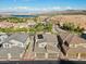 Scenic aerial view showcasing homes near a lake and mountains at 108 Kimberlite Dr, Henderson, NV 89011