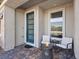 Inviting front porch with a modern fire pit, seating, and a stylish blue front door at 108 Kimberlite Dr, Henderson, NV 89011