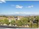 Spectacular view from the home showcasing rolling hills, a tranquil lake, and beautiful blue skies at 108 Kimberlite Dr, Henderson, NV 89011