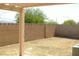 Spacious backyard enclosed by a block fence at 108 Zenith Point Ave, North Las Vegas, NV 89032