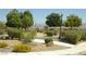 Landscaped common area in the community showing winding sidewalks and mature trees at 108 Zenith Point Ave, North Las Vegas, NV 89032